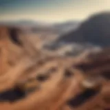 A panoramic view of a gold mining site in South Africa, showcasing the vast landscape and mining operations.